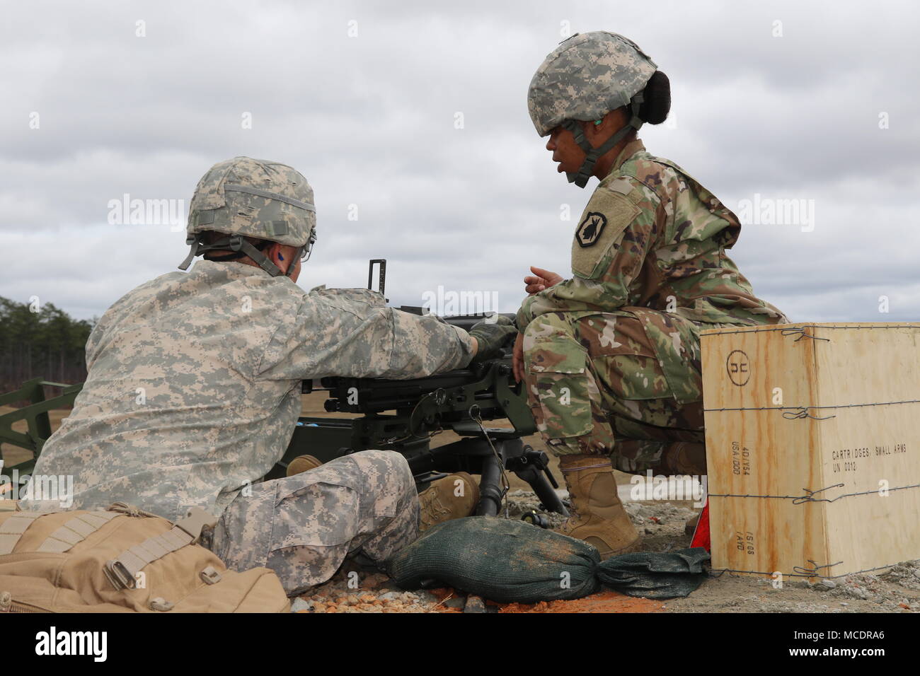 U.S. Army Reserve Drill Sergeant Staff Sgt. Shamika Mings coaches a Soldier  through a corrective action
