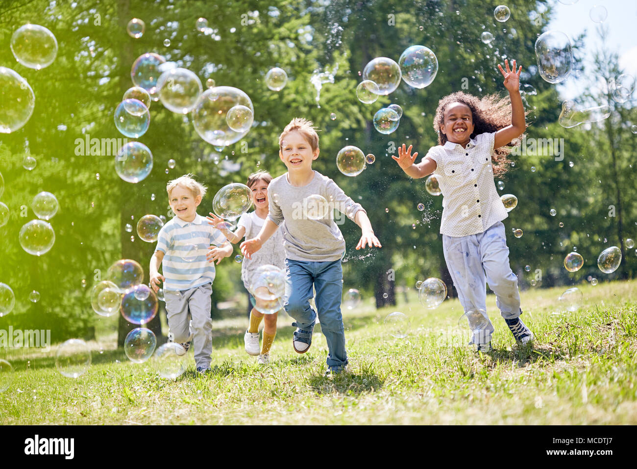 Little Kids Having Fun Outdoors Stock Photo