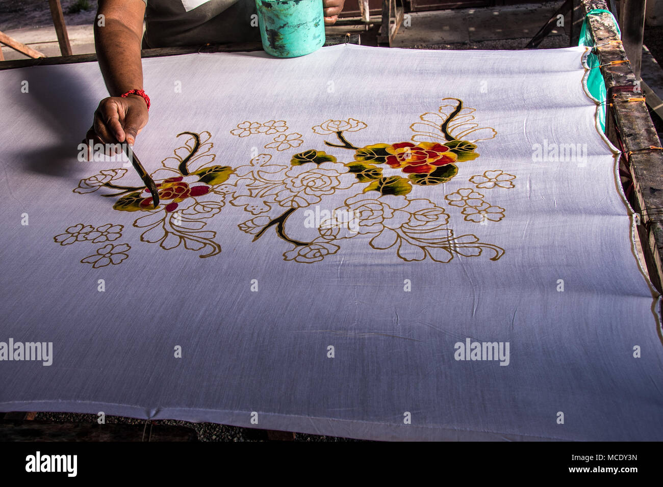 Working with the millenary Asian technique of batik Stock Photo