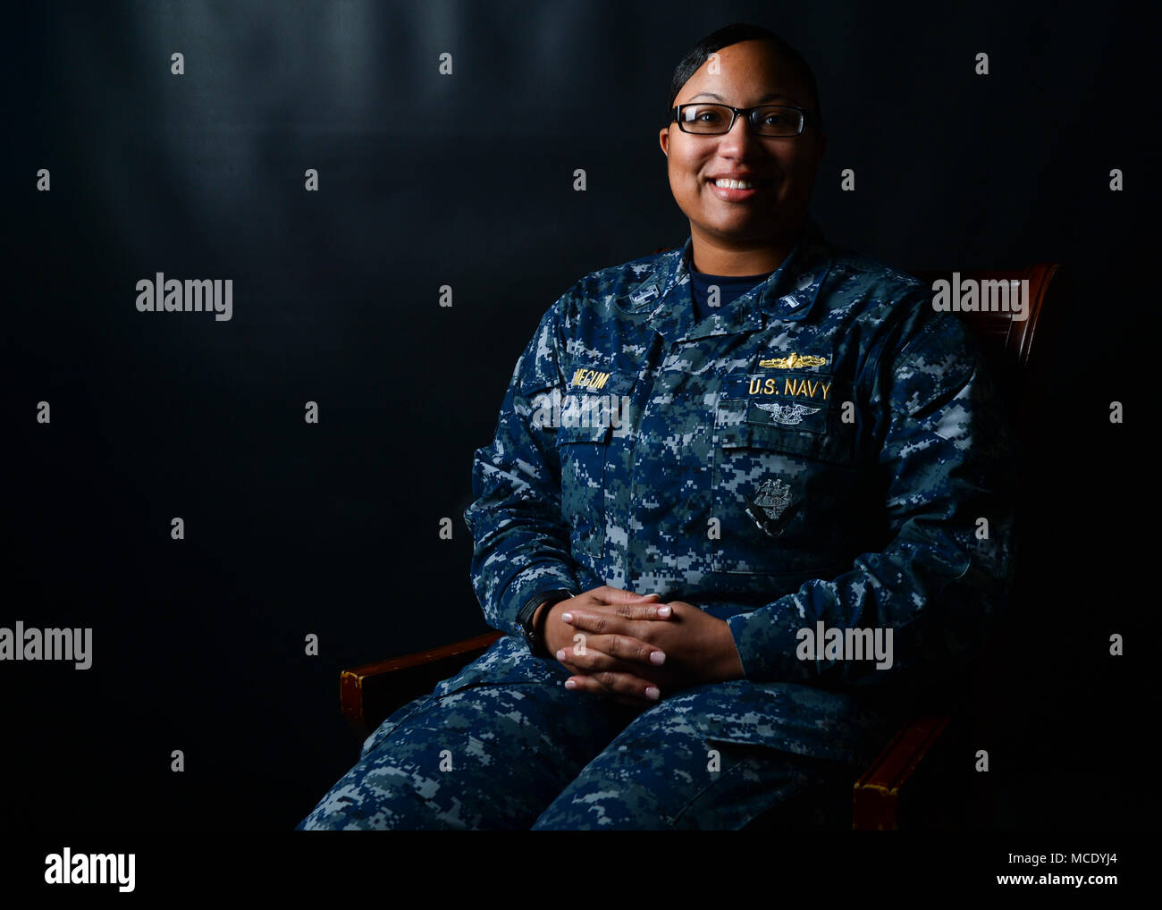 180215-N-OT701-028  NAVAL BASE KITSAP-BREMERTON, Wash. (Feb. 23, 2018) Lt. j.g. Erika Mecum, from Dallas, Texas, the assistant first lieutenant in deck department aboard the aircraft carrier USS Nimitz (CVN 68), poses for a picture aboard the Nimitz. Nimitz is currently preparing for a docking-planned incremental availability at Puget Sound Naval Shipyard and Intermediate Maintenance Facility where the ship will receive scheduled maintenance and upgrades. (U.S. Navy photo by Mass Communication Specialist Seaman Greg Hall) Stock Photo