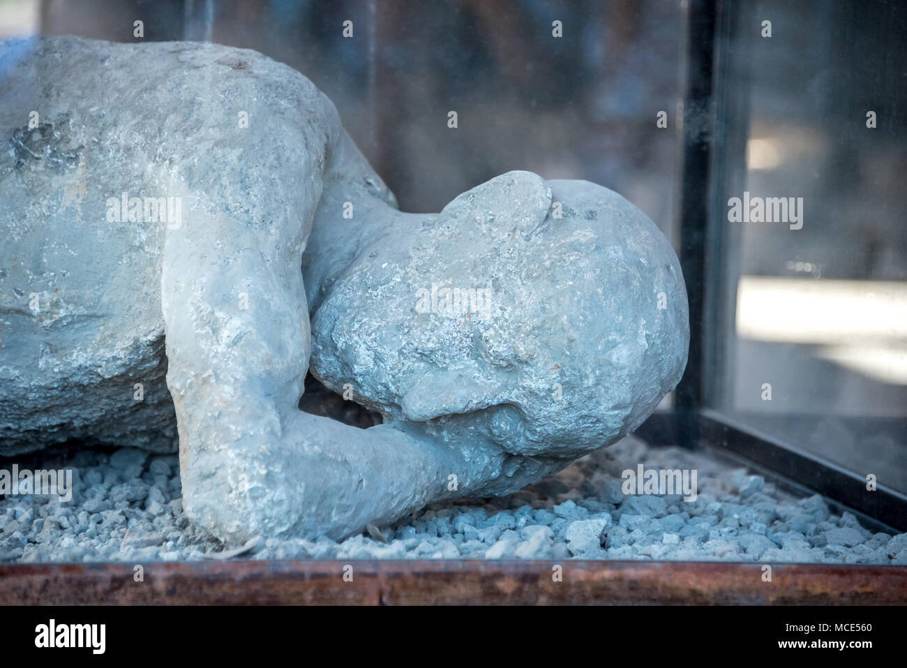 Plaster cast of man lying down in Pompeii archaeological park, one of many Pompeii residents killed in the Mt. Vesuvius eruption of 79 A.D. Stock Photo