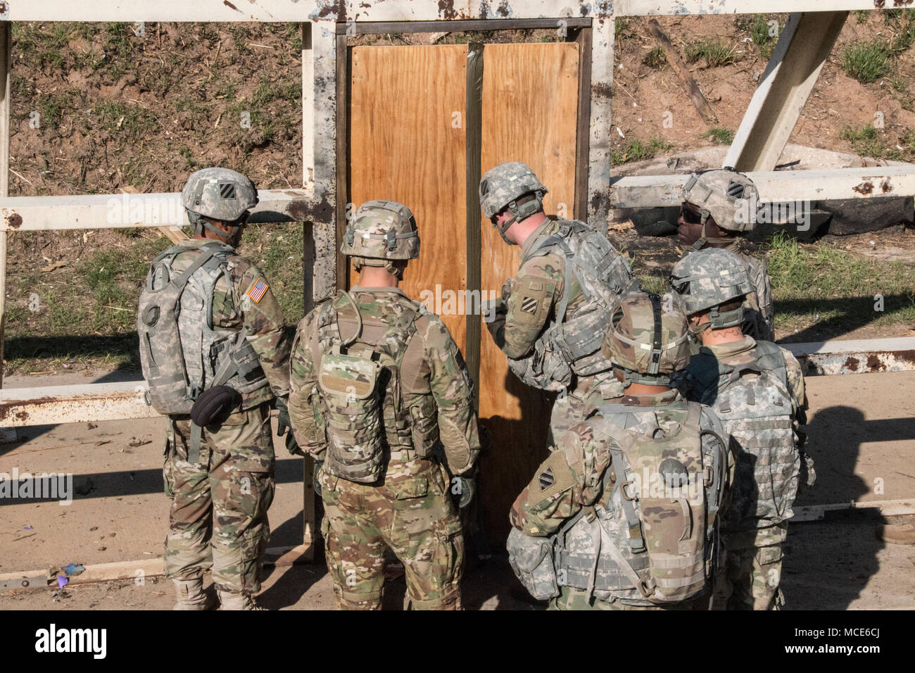 Soldiers of 9th Brigade Engineer Battalion, 2nd Armored Brigade Combat Team, 3rd Infantry Division breach a wooden door using improvised explosives Feb. 27 at Fort Stewart, Ga. The engineers were tested on their ability to construct improvised claymore mines and defend their position given an abbreviated planning window. (U.S. Army photo by Pfc. Regan Riggs/released) Stock Photo