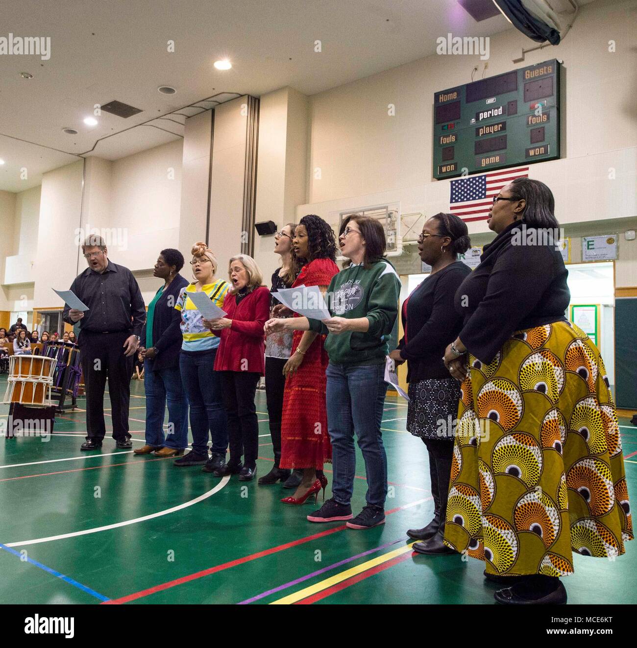 180223-N-LG762-078 YOKOSUKA, Japan (Feb. 23, 2018) Yokosuka Middle School Faculty sings The Black National Anthem during a Multicultural Night, Feb. 23.  The school's National Junior Honor Society (NJHS) hosted the unity-themed event which featured several performances from community members, local schools, and various performance groups. The student-led evening highlighted Dr. Martin Luther King's message of equality while celebrating Black History Month. (U.S. Navy photo by Mass Communication Specialist 2nd Class Zhiwei Tan/Released) Stock Photo