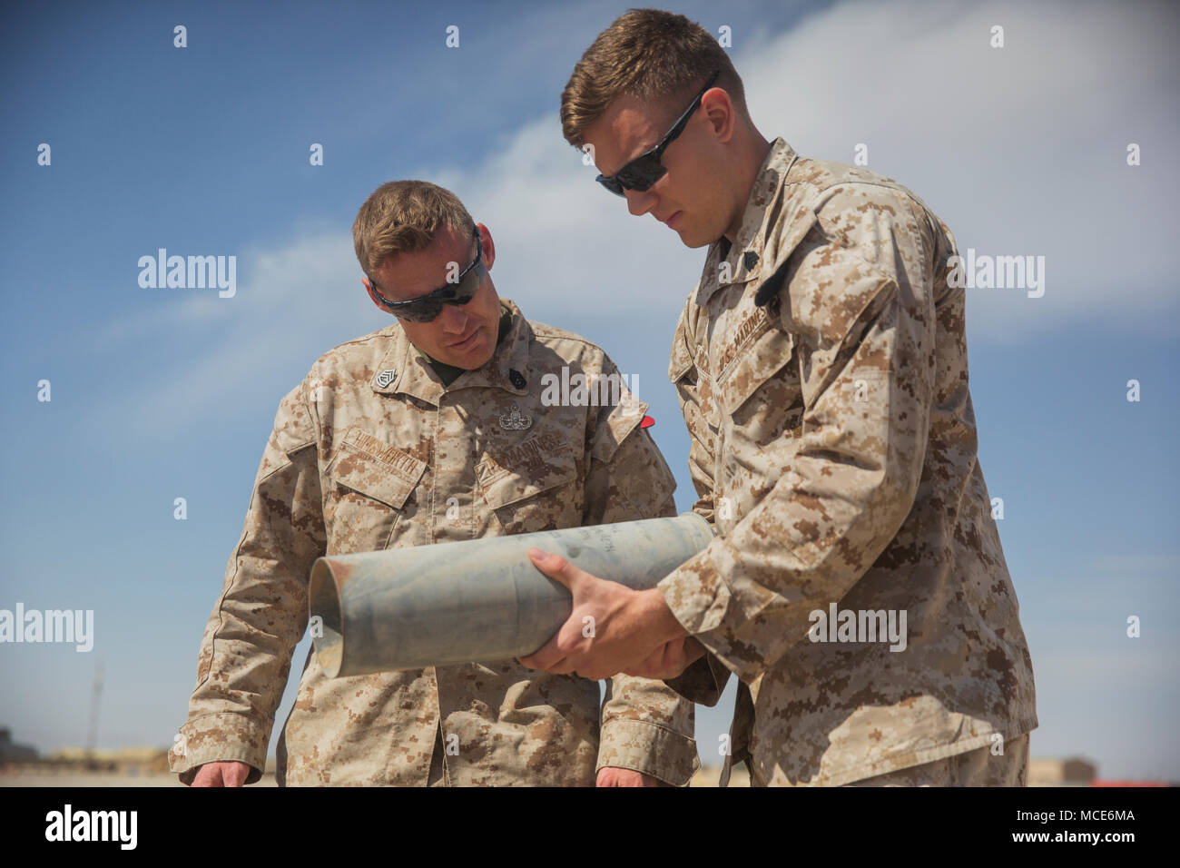 U.S. Marines with Task Force Southwest examine empty shell casings to ...
