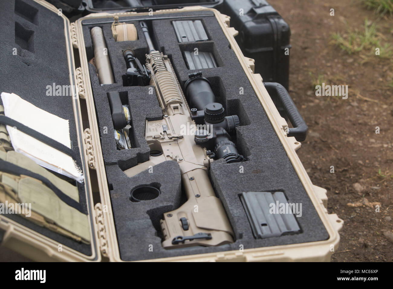 An m110 semi automatic sniper system lies inside its weapons case