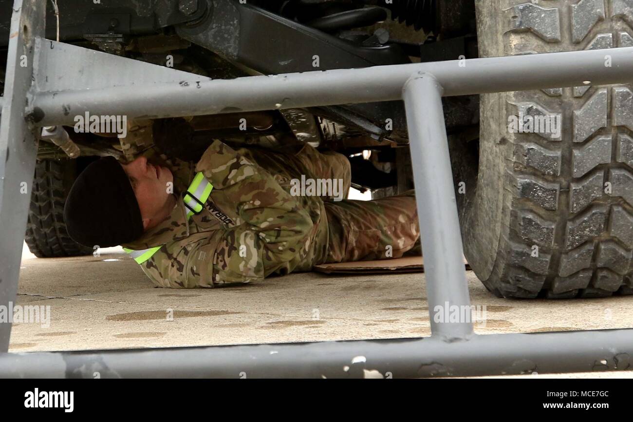 Camp Arifjan, KUWAIT – Sgt. Patrick Doran, a mechanic with Headquarters Support Company, Headquarters and Headquarters Battalion, 28th Infantry Division, inspects one of the HHBN vehicles at Ft. Hood, Texas in preparation for its shipment overseas. March 12, 2018, is a special day for the HHBN and its deployed Soldiers as the 28 ID celebrates its 139th birthday. (U.S. Army photo by Staff Sgt. Matthew Keeler) Stock Photo