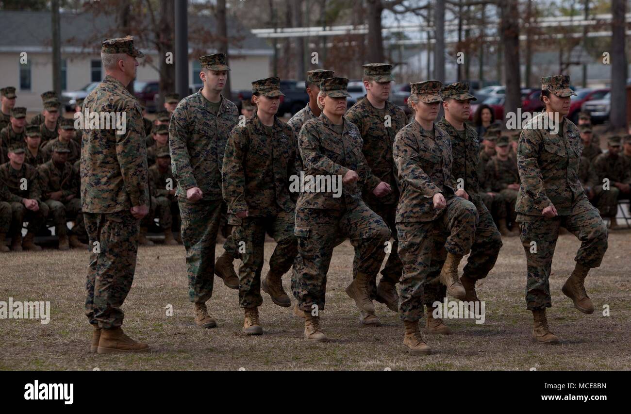 U.S. Sailors assigned to Field Medical Training Battalion-East (FMTB-E) march into the reviewing area for the FMTB-E change of command ceremony at Camp Johnson, N.C., Jan. 9, 2018. The change of command ceremony is a time-honered tradition in which one commander reliquishes command to another. (U.S. Marine Corps photo by Lance Corporal Tyler Pender) Stock Photo
