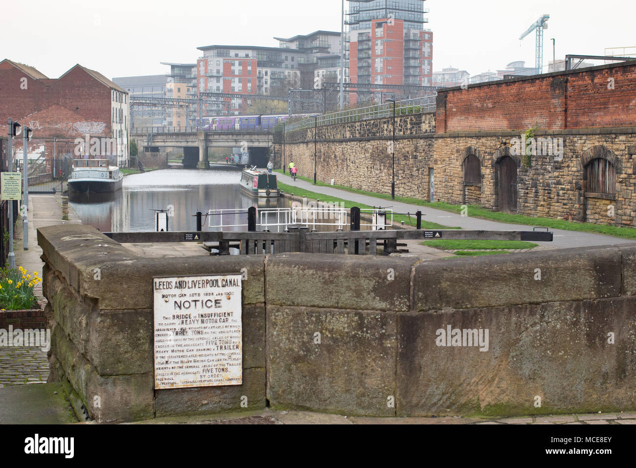The Leeds and Liverpool canal pictured in Leeds City Centre taken from Wharf approach bridge looking westwards. Stock Photo