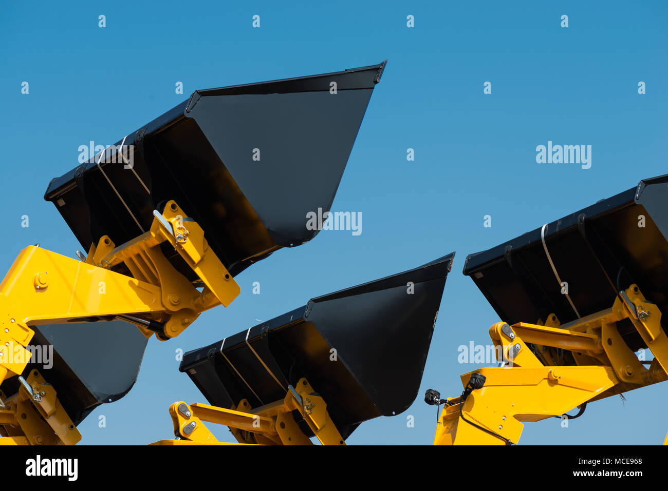 Closeup construction scoop against the sky. New construction scoops
