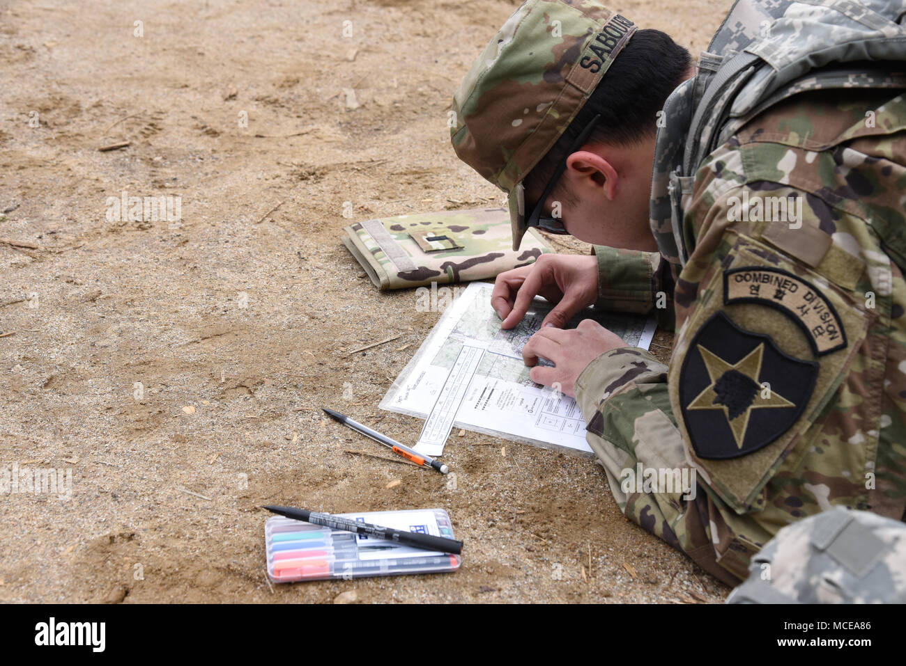 1st Lt. Evan Sabourin, assigned to Headquarters and Headquarters Battalion, 2nd Infantry Division/ROK-U.S. Combined Division, and native of Montclair, N.J., measures the distance between points on his map during the day land navigation event on the second day of the 2ID/RUCD Best Warrior competition at Camp Casey, April 10. The 2nd Infantry Division is conducting a weeklong Best Warrior Competition to identify and recognize the most outstanding officer, warrant officer, non-commissioned officer, U.S. Soldier, and Korean Augmentation To the United States Army (KATUSA) within the division. (U.S. Stock Photo