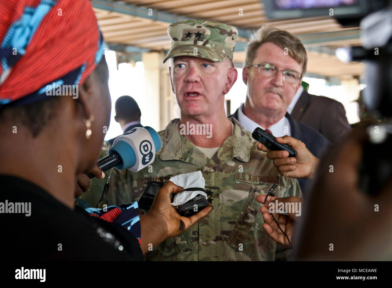 NIAMEY, Niger – U.S. Air Force Maj. Gen. Marcus Hicks, commander, Special Operations Command Africa, is interviewed by local media after the opening ceremony of Flintlock 2018 in Niamey, Niger, April 11, 2018. Flintlock, hosted by Niger, with key outstations at Burkina Faso and Senegal, is designed to strengthen the ability of key partner nations in the region to counter violent extremist organizations, protect their borders, and provide security for their people. (U.S. Army Photo by Sgt. Heather Doppke/79th Theater Sustainment Command) Stock Photo