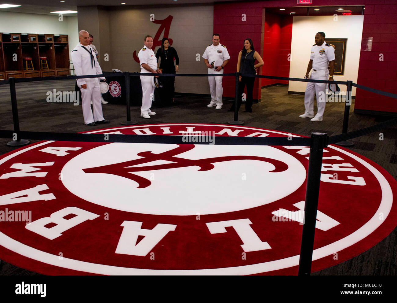 180411-N-MJ645-0193 TUSCALOOSA, Ala. (April 11, 2018) Sailors participate in a tour of the University of Alabama football locker room at Bryant-Denny Stadium as part of Navy Week Birmingham. The Navy Office of Community Outreach uses the Navy Week program to bring Navy Sailors, equipment and displays to approximately 14 American cities each year for a weeklong schedule of outreach engagements. (U.S. Navy photo by Mass Communication Specialist 1st Class Marcus L. Stanley/Released) Stock Photo