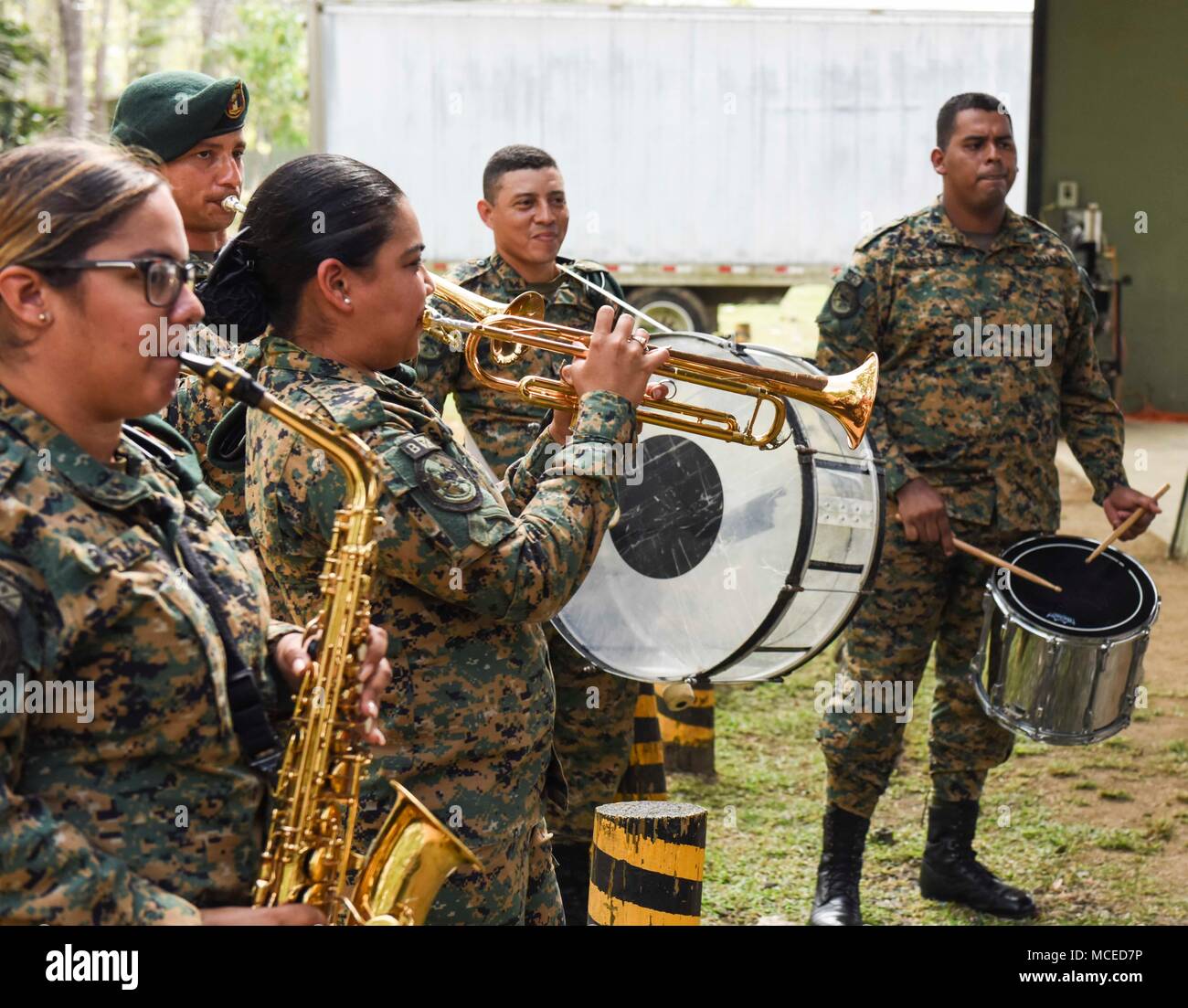 Members of the Panamanian National Border Service, known as SENAFRONT, play instruments during the opening ceremony of Exercise New Horizons 2018, April 11, 2018, in Meteti, Panama. Exercise New Horizons is a joint-service training exercise, focused on enhancing relations with partner nations and providing aid to local communities while providing training U.S. military members. During the exercise, U.S. military members will build three schools, one community center and a women’s health ward in the Meteti area. They will also work closely with Panamanian health providers bringing medical aid t Stock Photo
