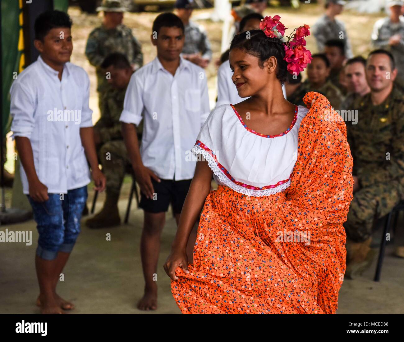 A student from a local school in Meteti, Panama, performs a dance for guests at the opening ceremony for Exercise New Horizons 2018, April 11, 2018. Representatives from the Ministry of Education, Ministry of Health, Ministry of Security, the government of Panama, the mayor of Meteti, and the commander of the 346th Air Expeditionary Group who the exercise falls under, Col. Darren Ewing, took part in the ceremony which was attended by about 150 community members. The joint-service exercise will provide deployment readiness training to U.S. military members, while also benefiting local communiti Stock Photo