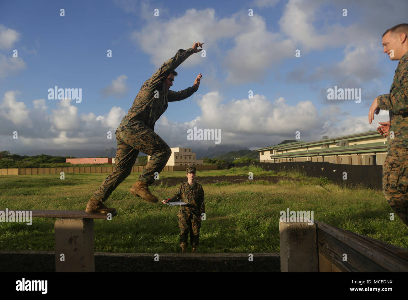 A U.S. Marine from Marine Corps Forces, Pacific jumps from an ...