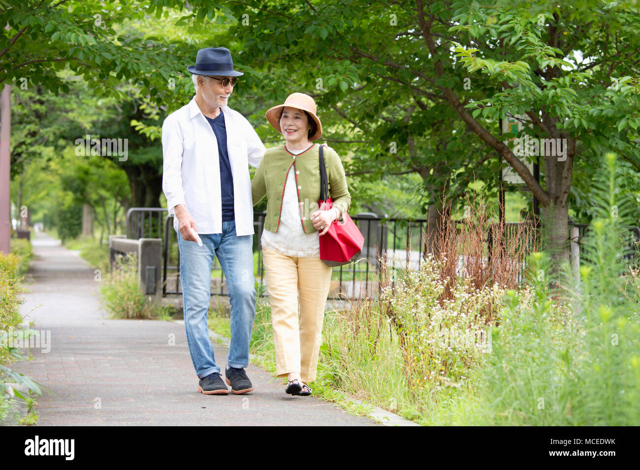Senior couple walking around Stock Photo - Alamy