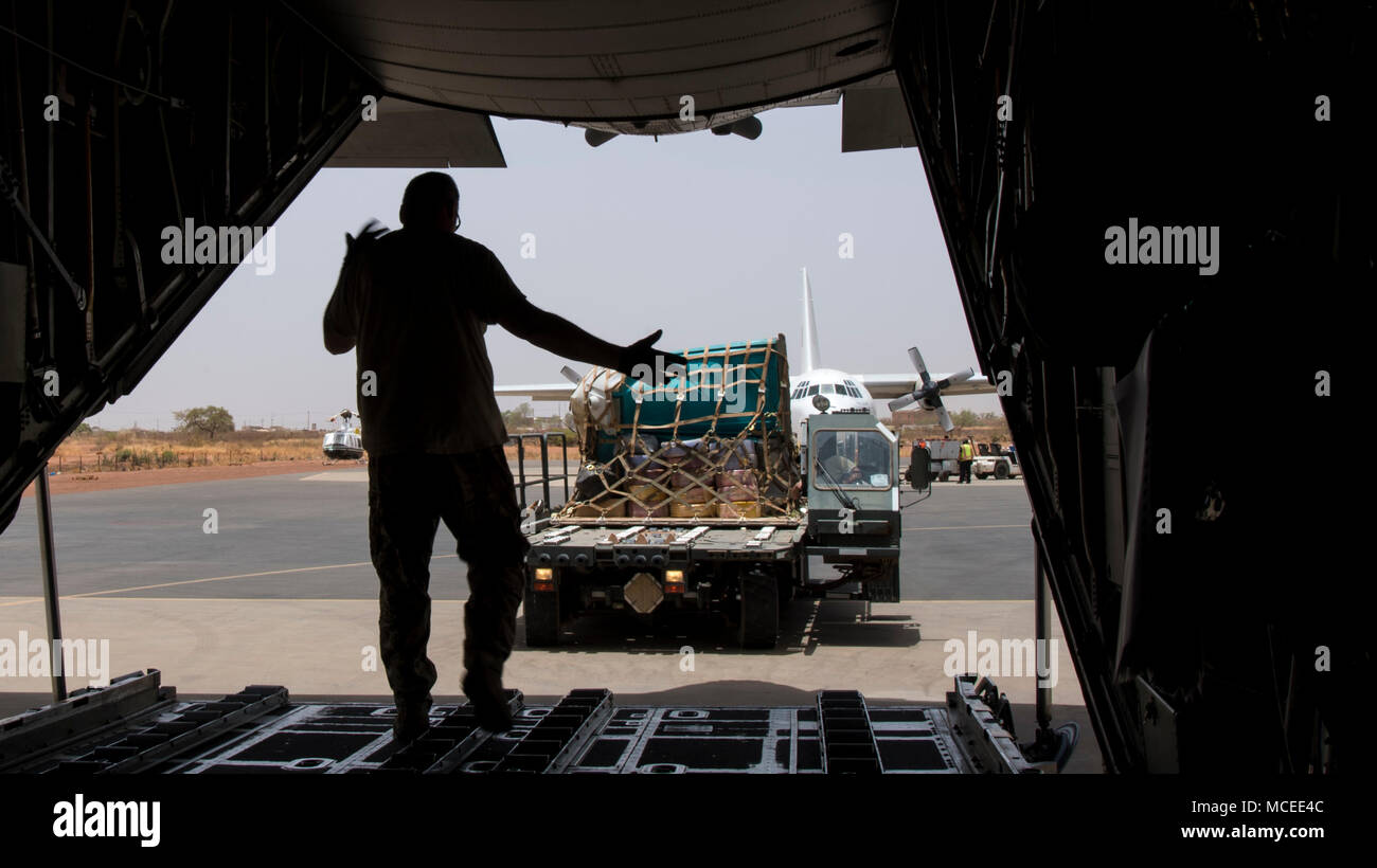A loadmaster from the West Virginia Air National Guard marshals in a K-loader April 11, 2018, at Diori Hamani International Airport, Niger. Approximately 1,900 service members from more than 20 African and western partner nations are participating in Flintlock 2018 at multiple locations in Niger, Burkina Faso, and Senegal. Flintlock is an annual, African-led, integrated military and law enforcement exercise that has strengthened key partner nation forces throughout North and West Africa as well as western Special Operations Forces since 2005.  (U.S. Air Force photo/Senior Airman Clayton Cupit) Stock Photo