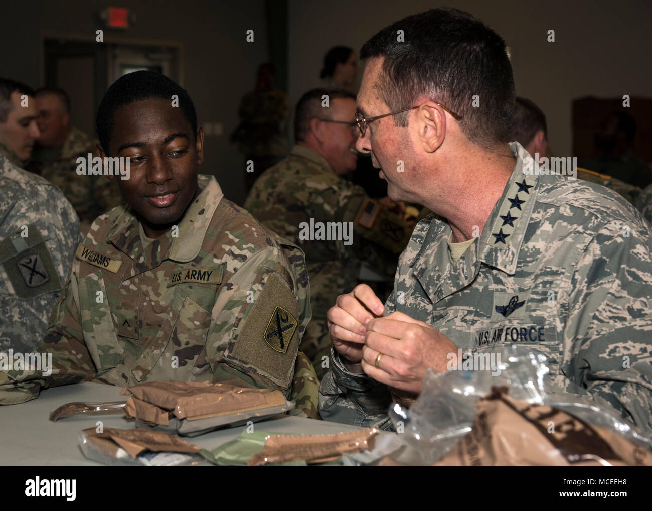General Joseph L. Lengyel, Chief of the National Guard Bureau, has lunch with Pvt. Darryl Williams and Soldiers of the South Carolina Army National Guard who are participating in Guardian Response 18, April 14, 2018, North Vernon, Indiana. (U.S. Army National Guard photo by Sgt. Brian Calhoun, 108th Public Affairs Det.) Stock Photo
