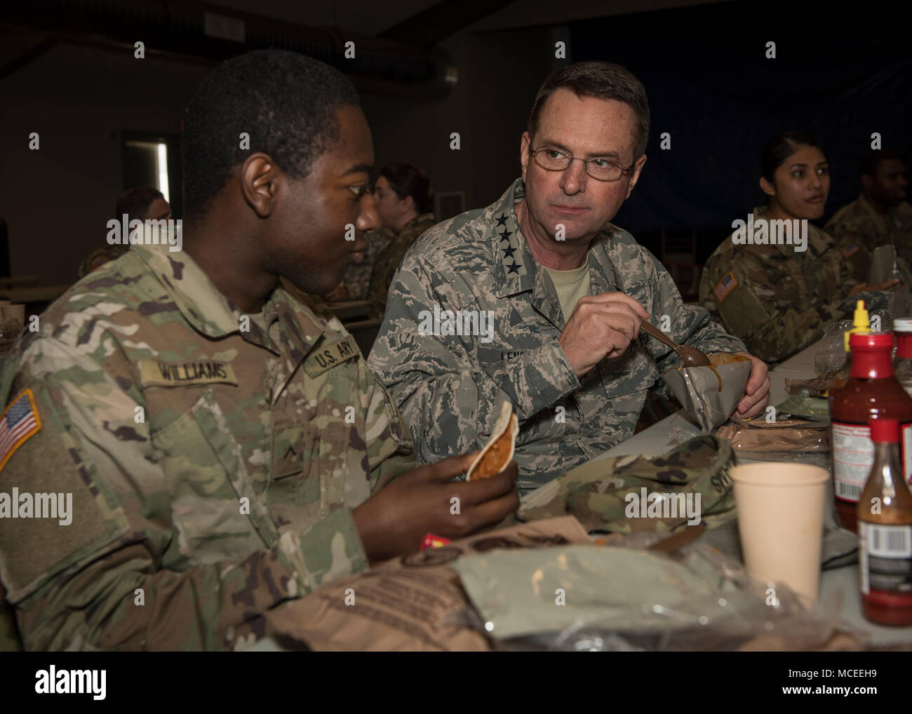 General Joseph L. Lengyel, Chief of the National Guard Bureau, has lunch with Pvt. Darryl Williams and Soldiers of the South Carolina Army National Guard who are participating in Guardian Response 18, April 14, 2018, North Vernon, Indiana. (U.S. Army National Guard photo by Sgt. Brian Calhoun, 108th Public Affairs Det.) Stock Photo