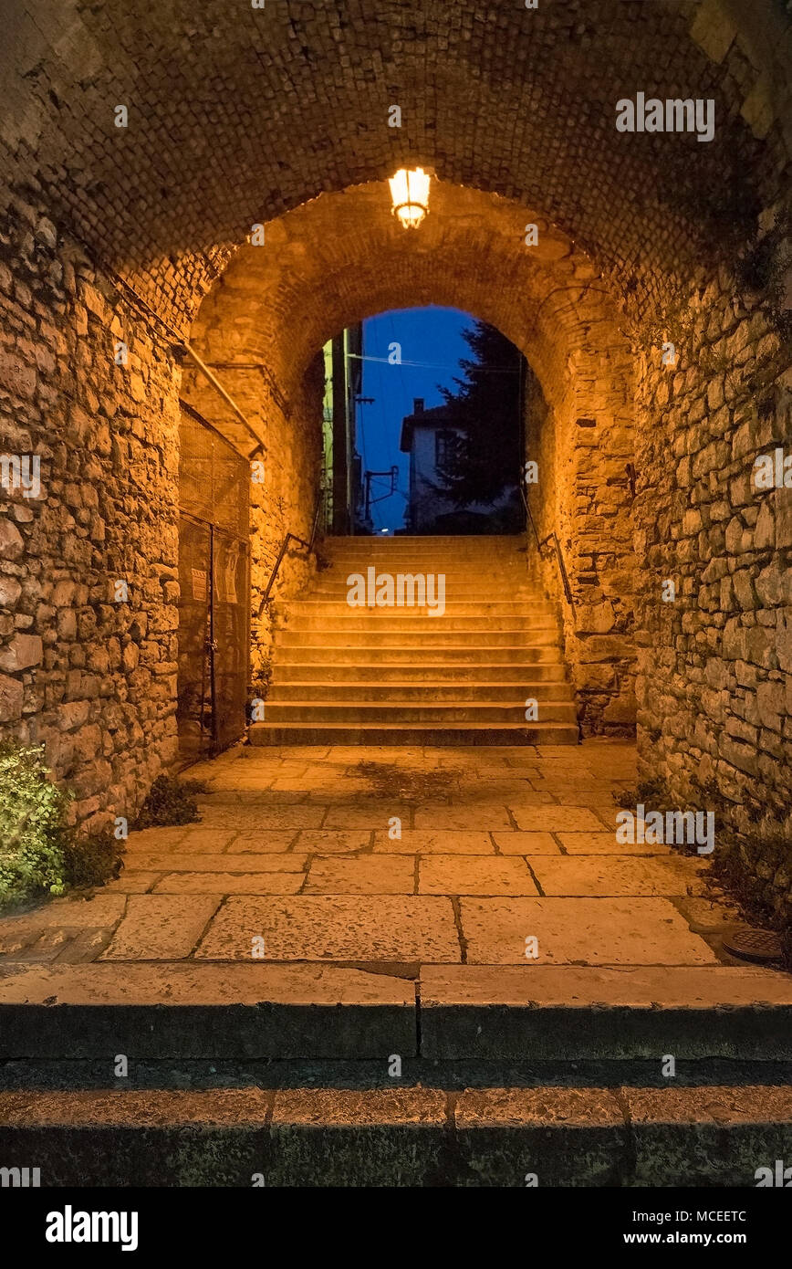 Arch entrance with stone walls to the old city of  Ioannina at night, Greece Stock Photo