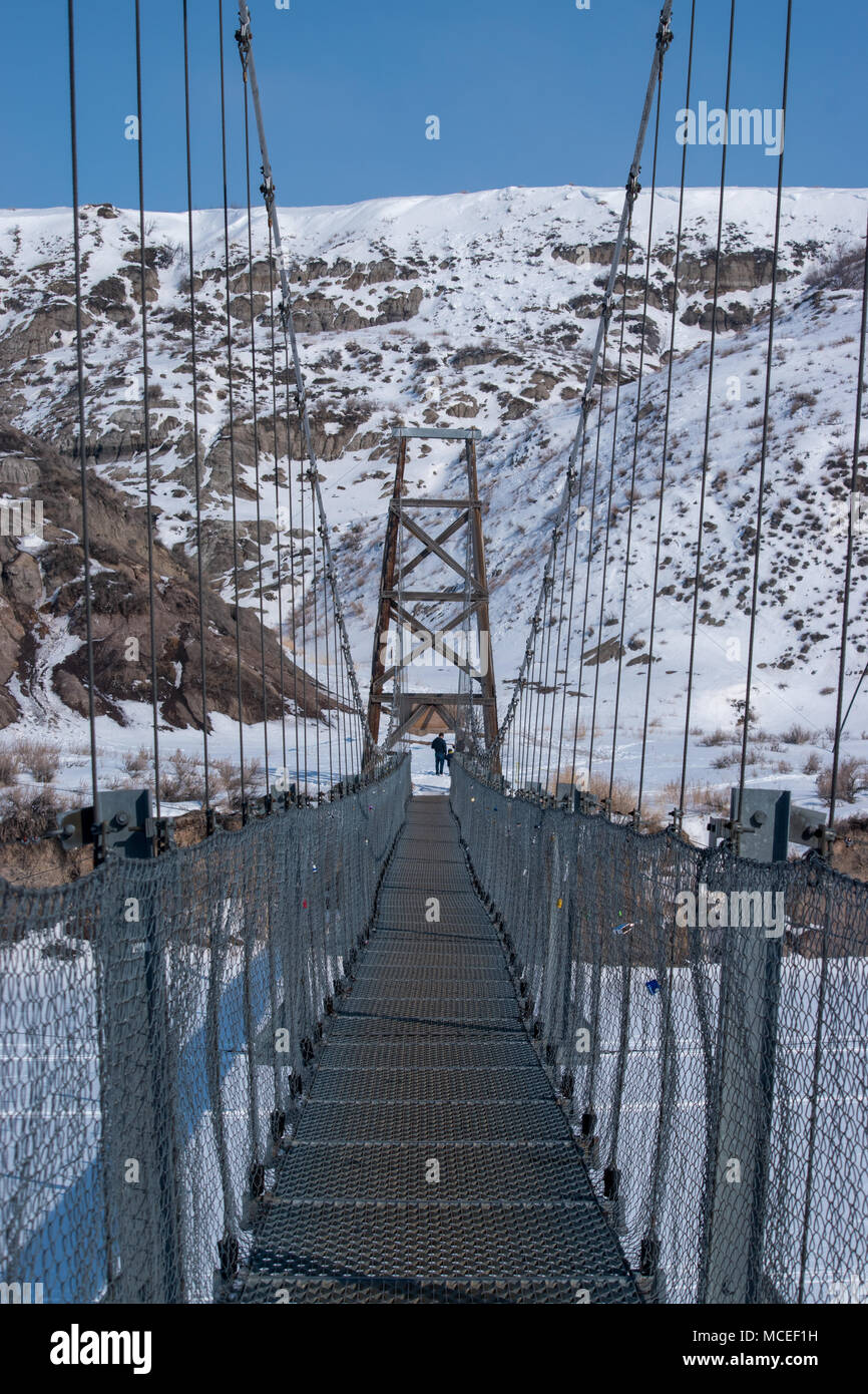 The Star Mine Suspension Bridge is a 117 meter long pedestrian suspension bridge across the Red Deer River in Drumheller, Alberta. Constructed in 1931 Stock Photo