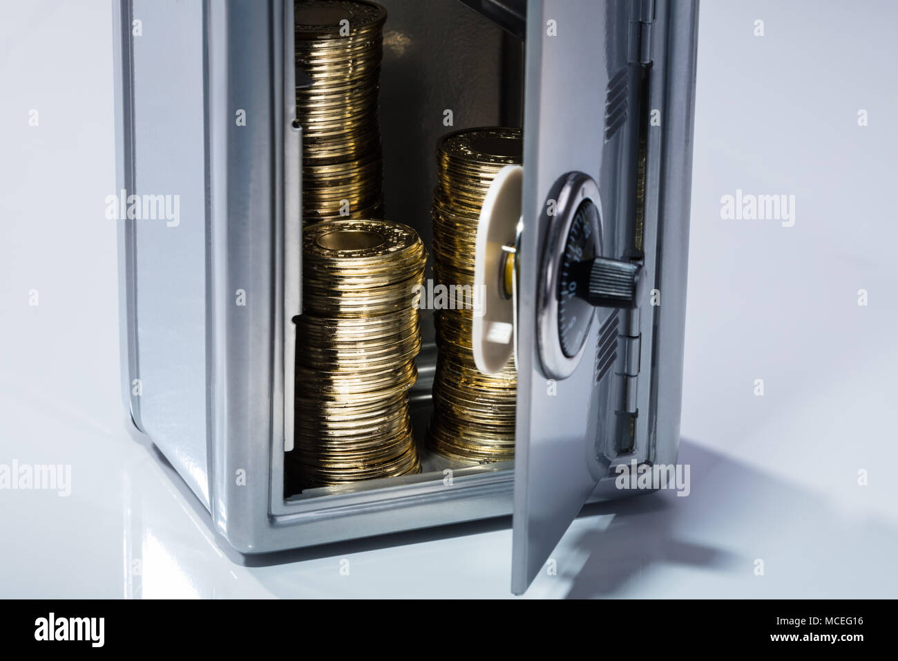 Closeup Of An Open Safe With Stacked Golden Coins Stock Photo Alamy