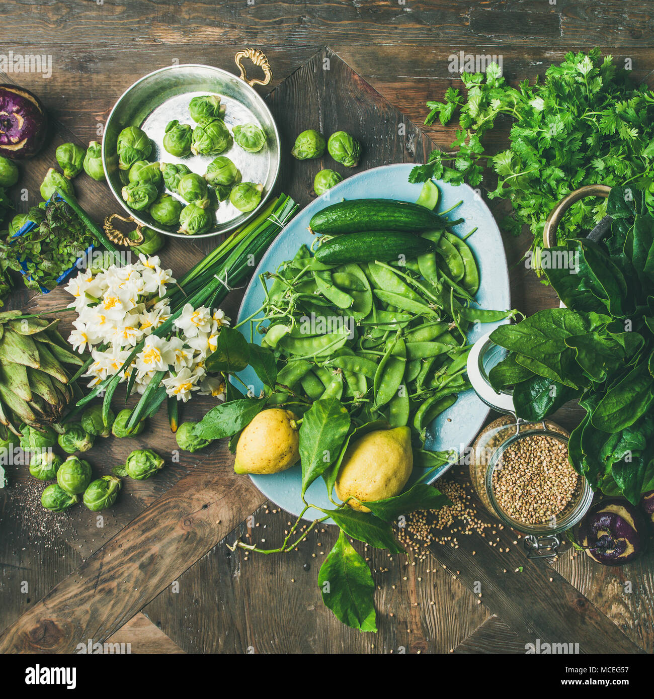 Spring healthy vegan food cooking ingredients, wooden background ...