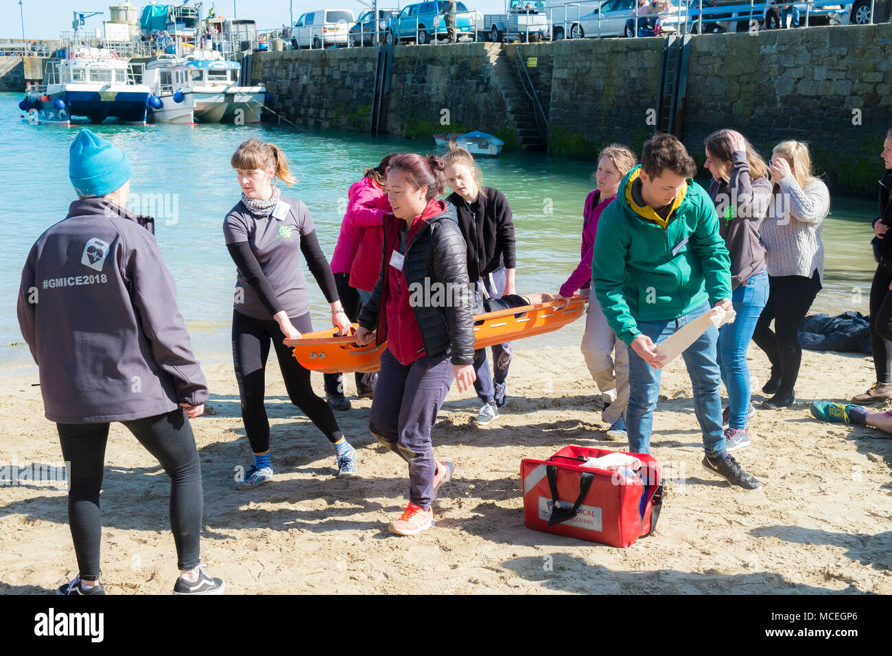 Volunteers participating in a GMICE (Good Medicine in Challenging Environments) major incident exercise in Newquay Harbour in Cornwall. Stock Photo