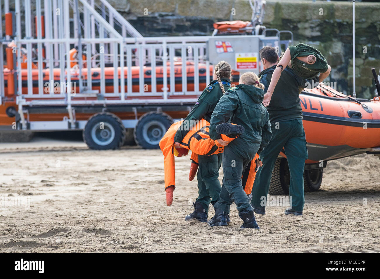 Volunteers and health professionals preparing for participating in a GMICE (Good Medicine in Challenging Environments) major incident exercise in Newq Stock Photo