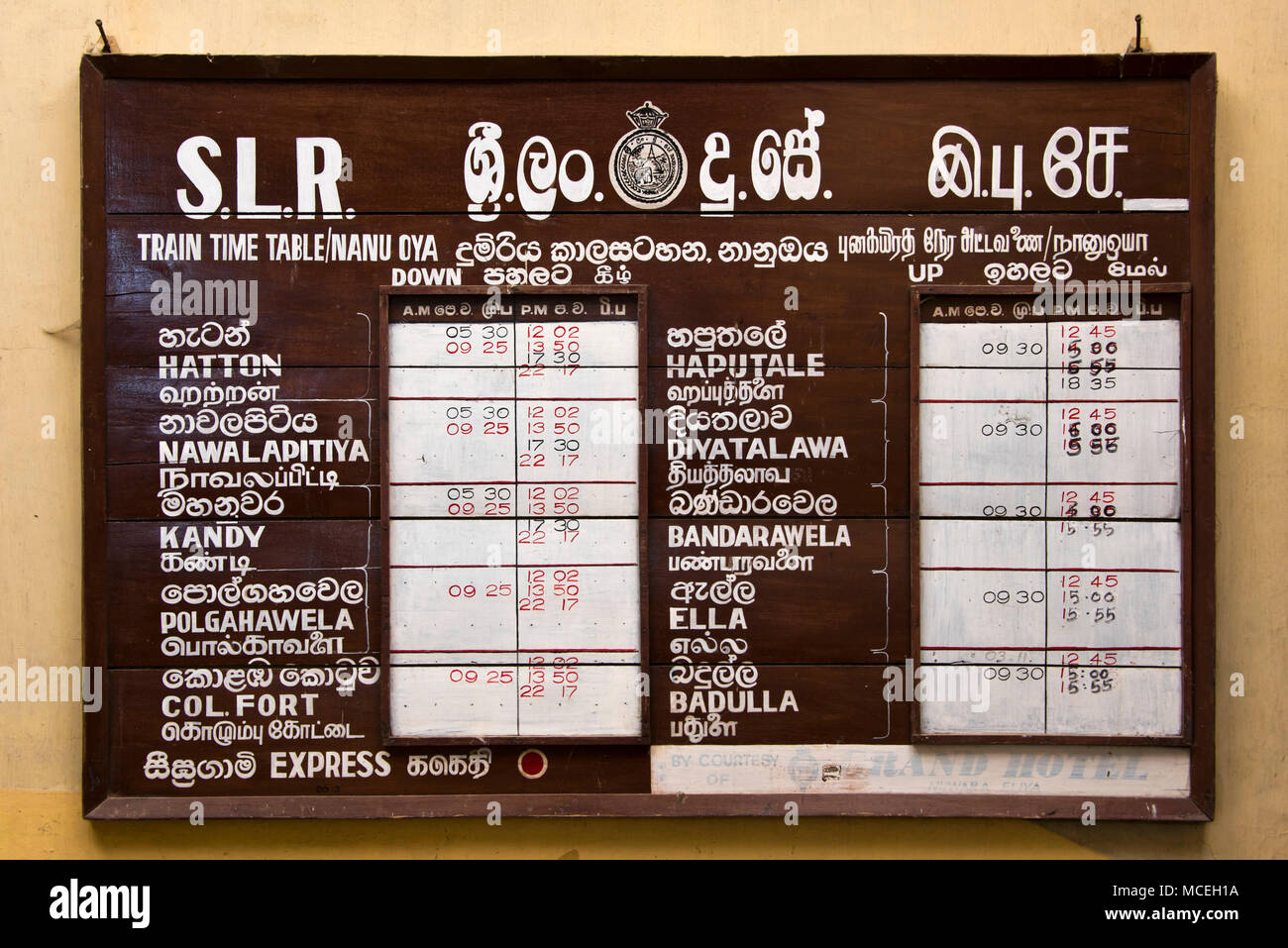 Horizontal view of the hand written timetable at Nanu-oya Train Station in the highlands of Sri Lanka. Stock Photo