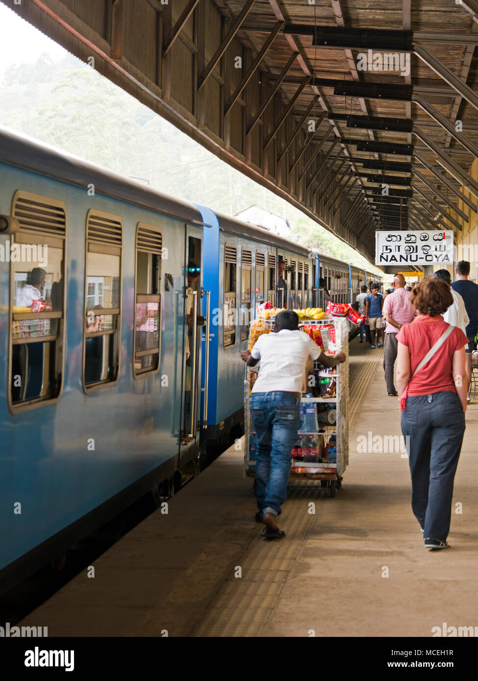 Vertical view of people at Nanu-oya Train Station in the highlands of Sri Lanka. Stock Photo