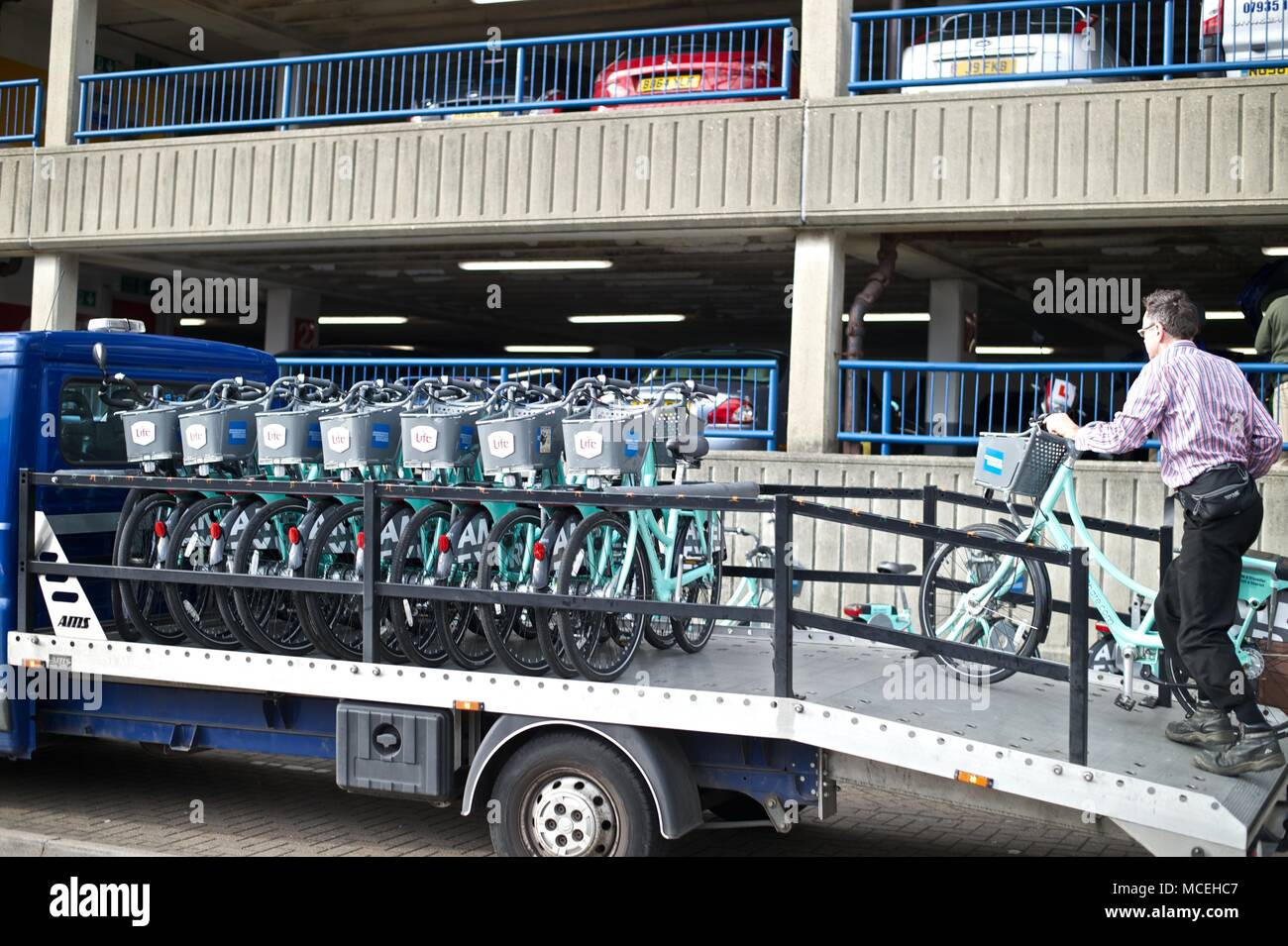 Brighton Bike Hire scheme with man offloading bikes at docking station