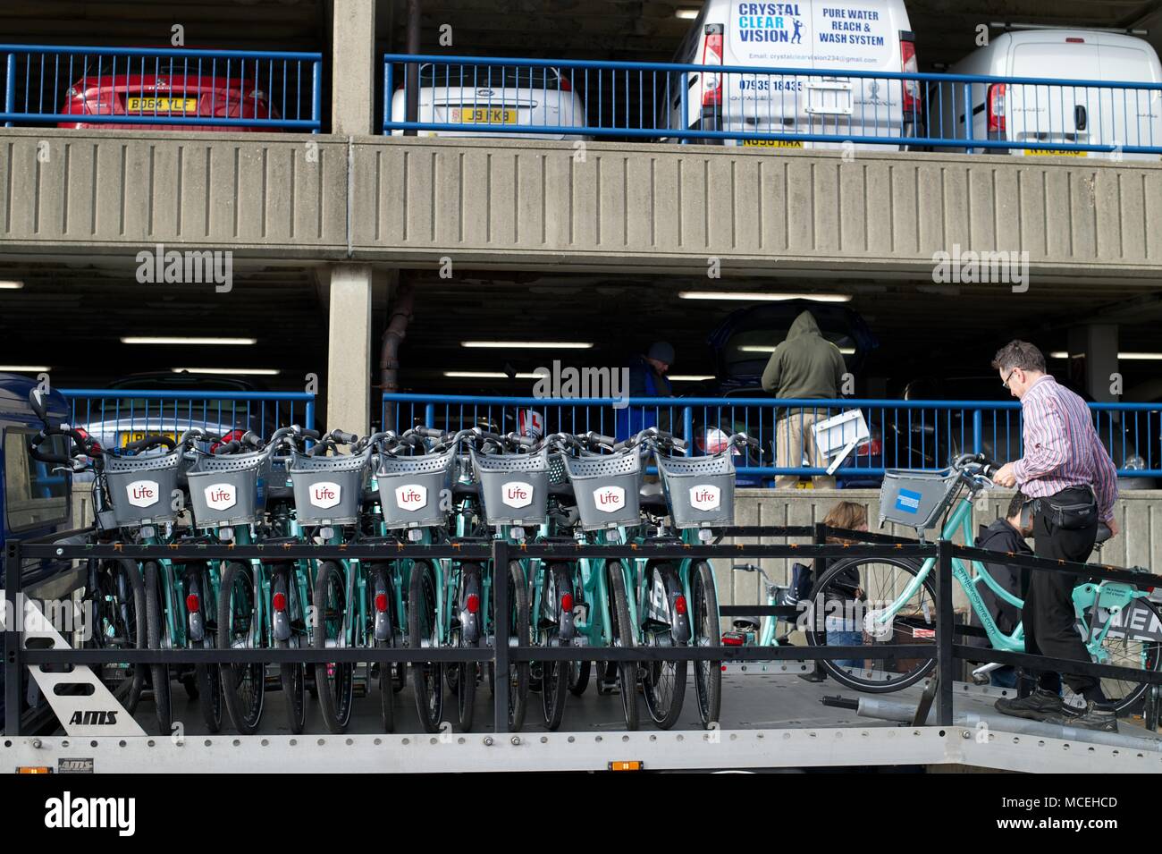 Brighton Bike Hire scheme with man offloading bikes at docking station
