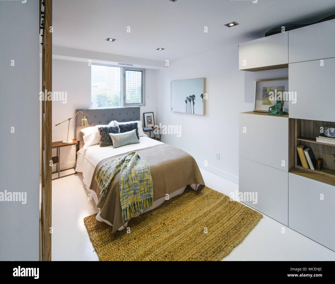 Interior of cozy bedroom in modern design Stock Photo - Alamy