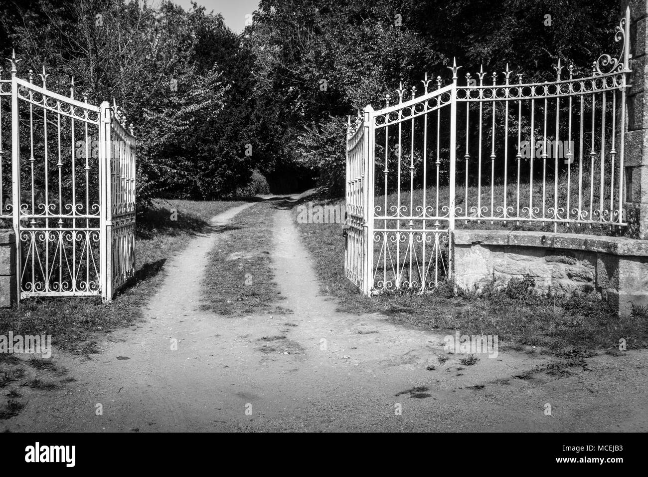 View of opened gate leading to a farm, Brittany, France, Europe Stock Photo