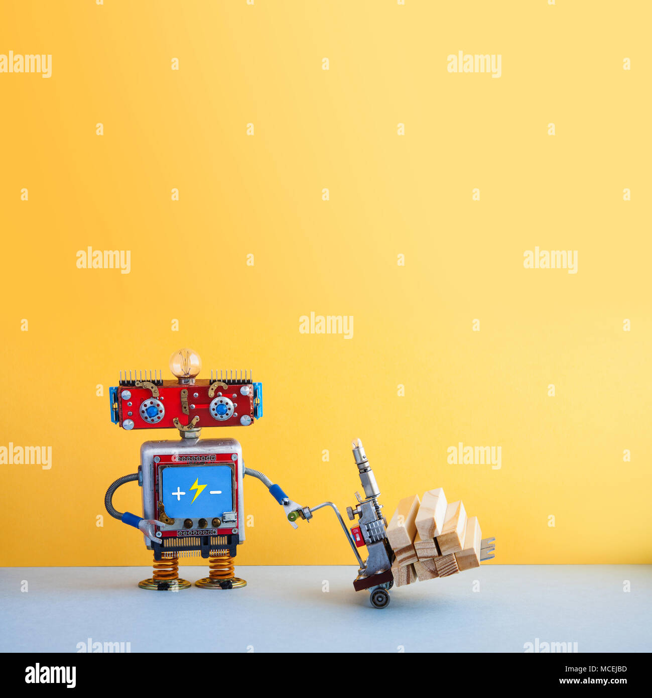 Robot moving powered pallet jack with wooden blocks. Forklift cart