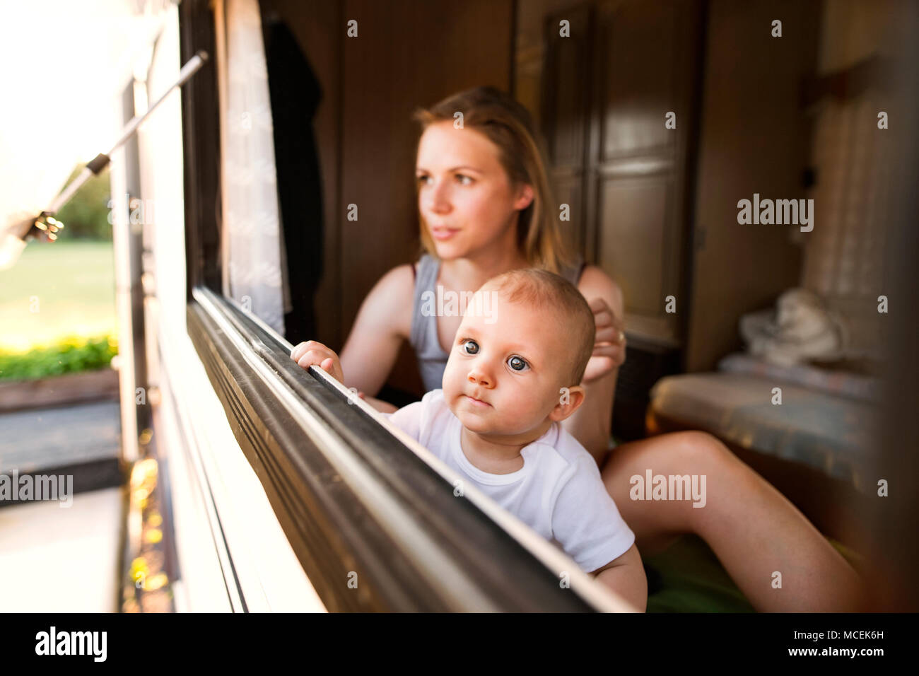 Mother and baby son in a camper van Stock Photo Alamy