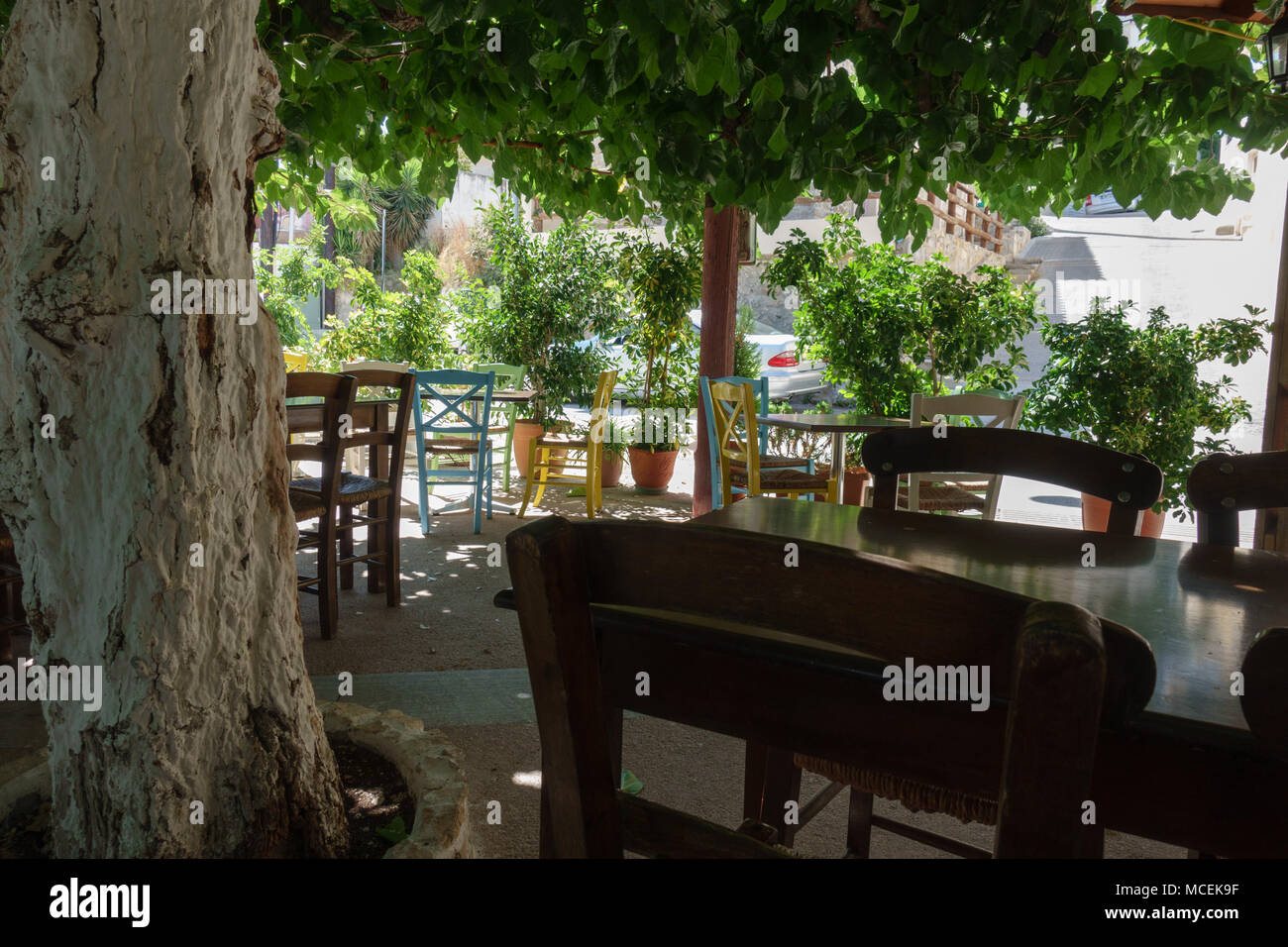 Chairs and table at outdoor cafe, Crete, Greece Stock Photo Alamy