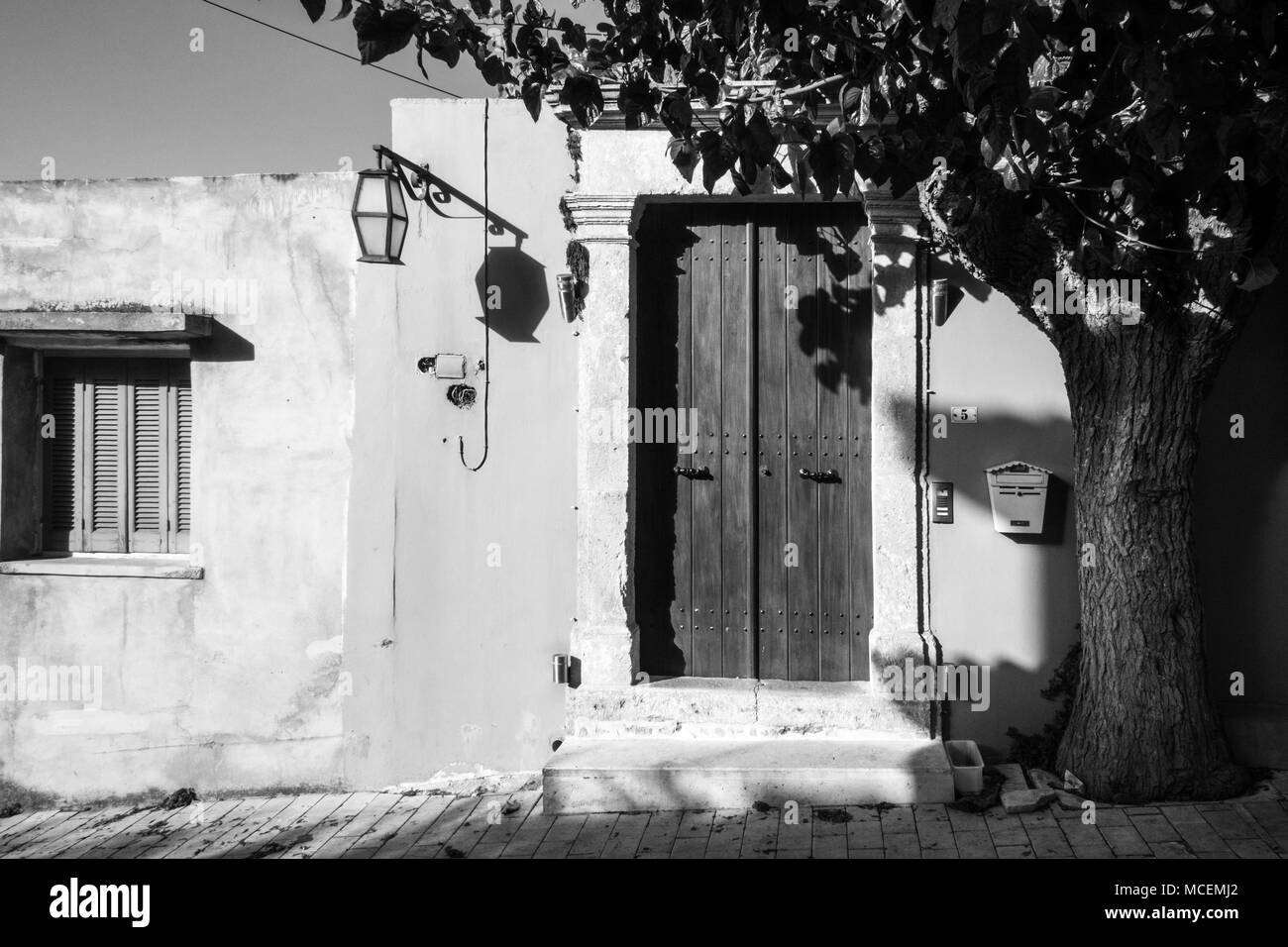 Closed wooden door of house, Archanes, Crete, Greece Stock Photo