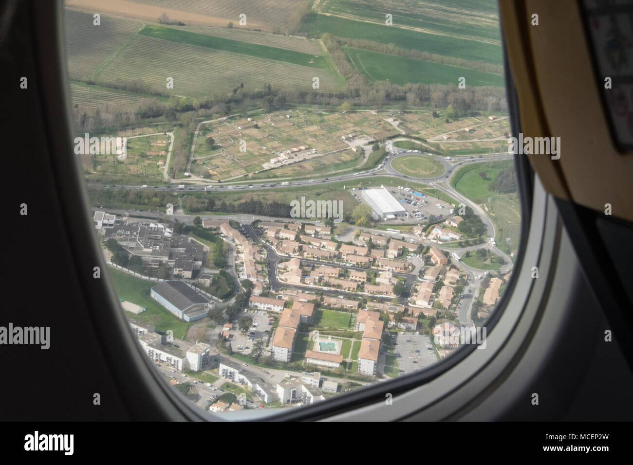 Window,seat,view,above,aerial,of,Carcassonne,Airport,Irish,airline,Ryanair,flight,from,Carcassonne,Airport,South,of,France,heading,to,Manchester,Engla Stock Photo