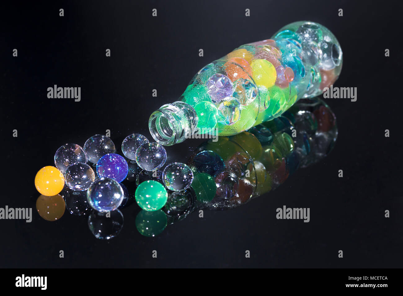 Bottle with spread hydrogel balls Stock Photo