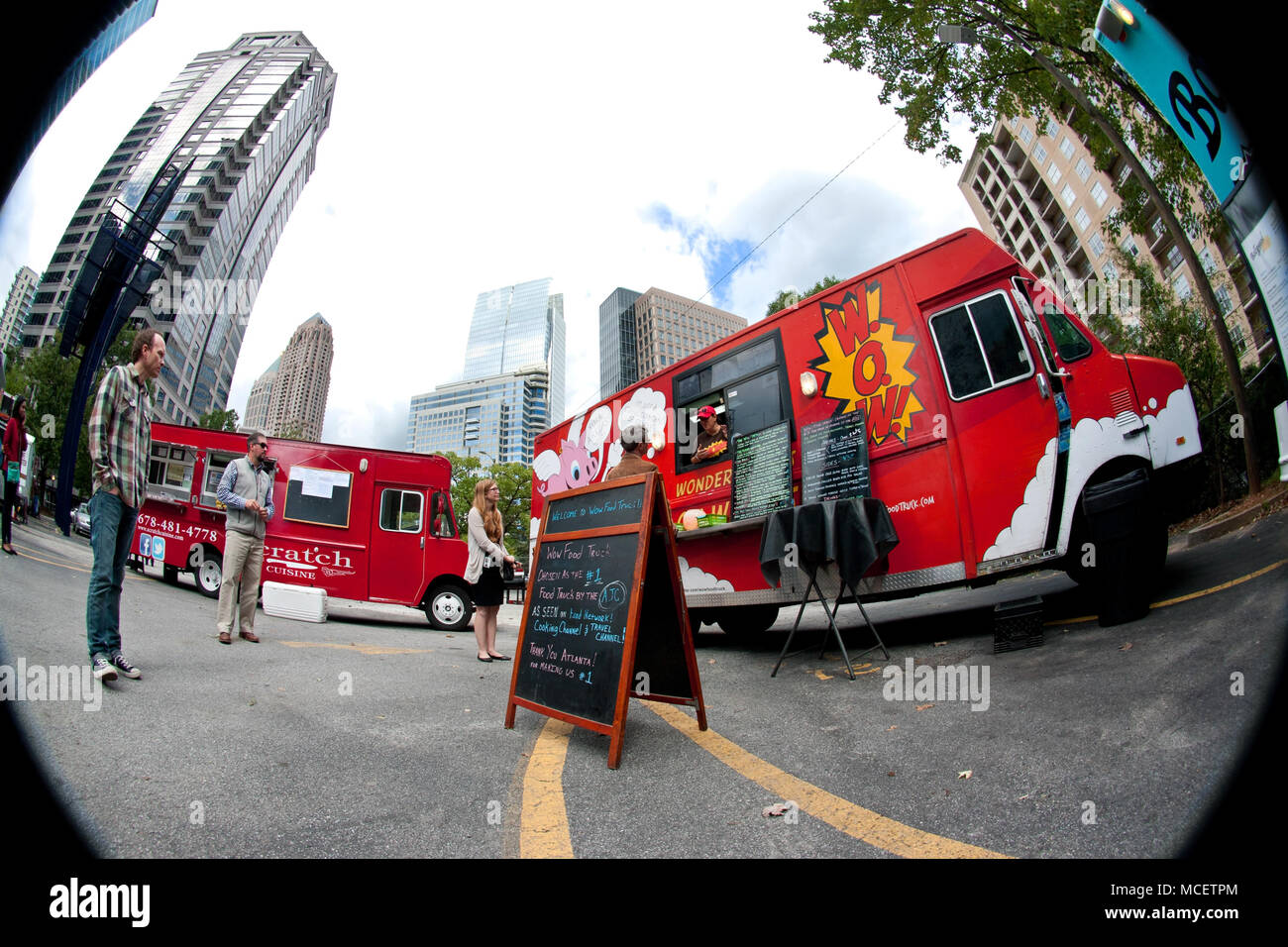 Fish-eye view of customers standing in line to order meals from food trucks at 'Food Truck Thursday' on October 16, 2014 in Atlanta, GA. Stock Photo