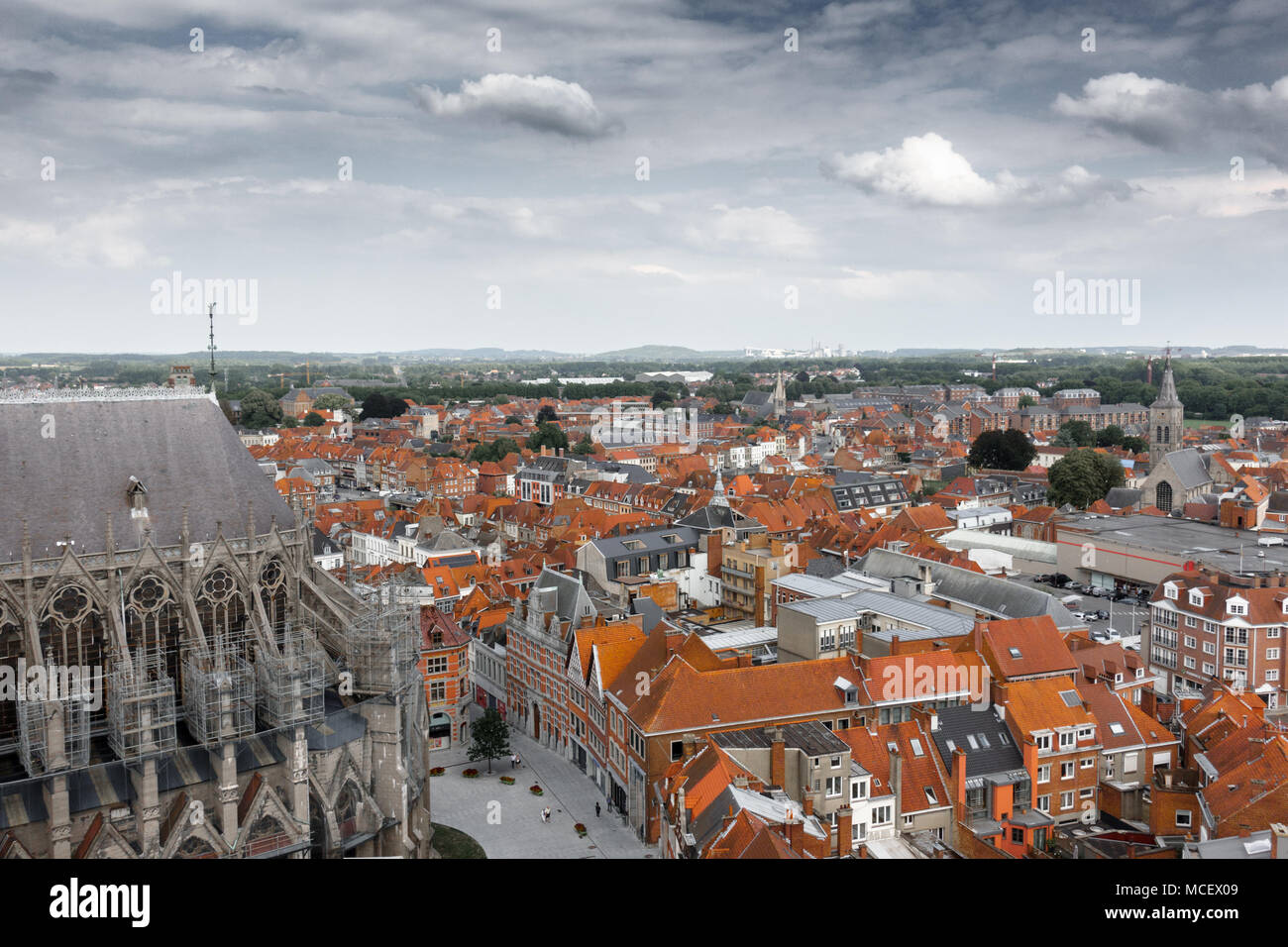 Church and city buildings in Tournai, Belgium Stock Photo