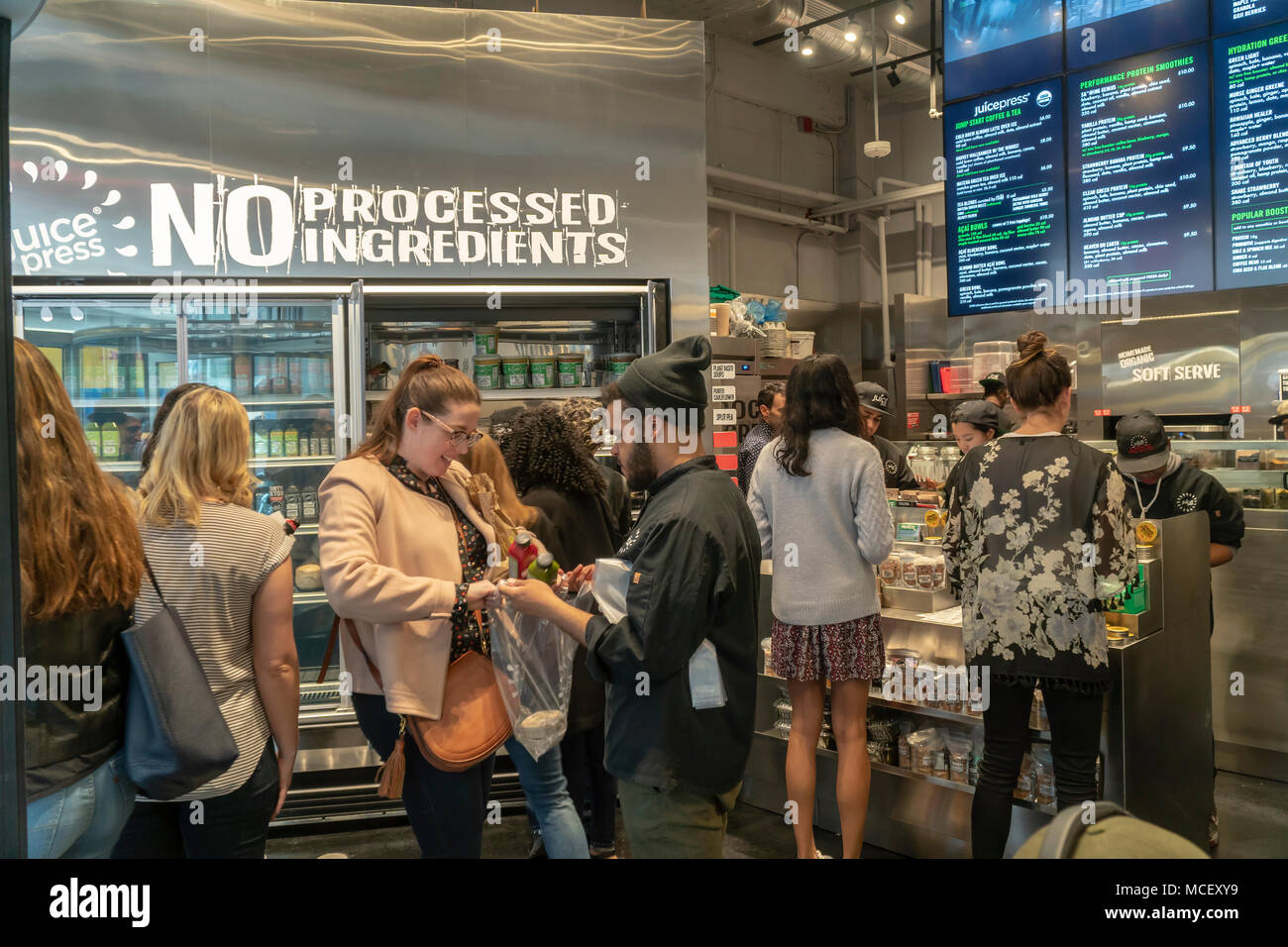 Hordes of millennials crowd the new Juice Press grand opening