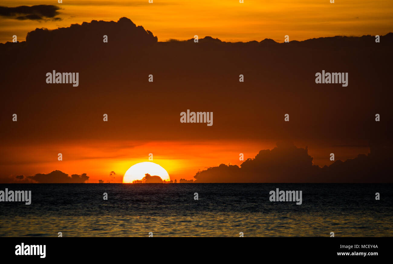 Carabao Island (Philippines) ,8 March 2018, The sun under the clouds Stock Photo