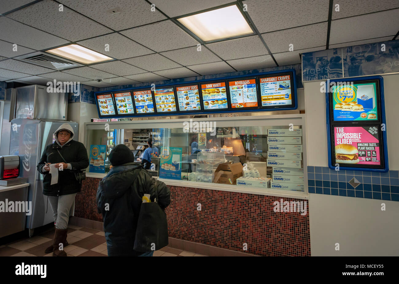 White Castle debuts the Impossible Slider using plant-based 'meat' from Impossible Foods, seen in a White Castle in Brooklyn in New York on Sunday, April 15, 2018. Impossible Foods meatless ground beef is being used to create the new menu item, previously only available in higher-end fast casual restaurants and is currently on the menu is 140 locations in the New York and Chicago areas.The sliders sell for $1.99, approximately double the price of their original product. (© Richard B. Levine) Stock Photo