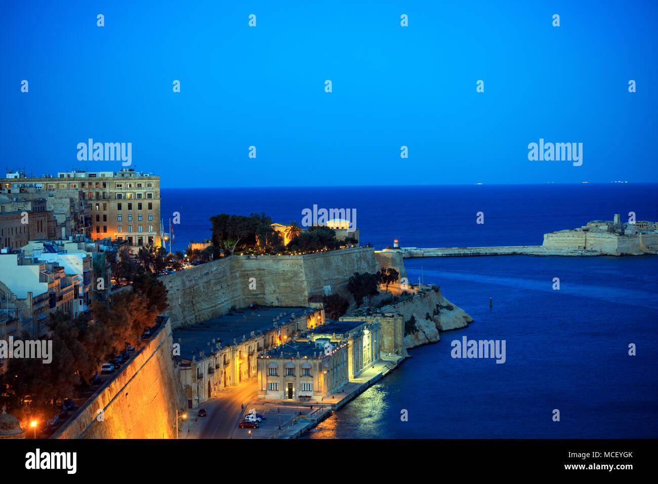 Valletta, Malta. Grand harbour entrance view from Upper Barrakka Gardens in the evening Stock Photo