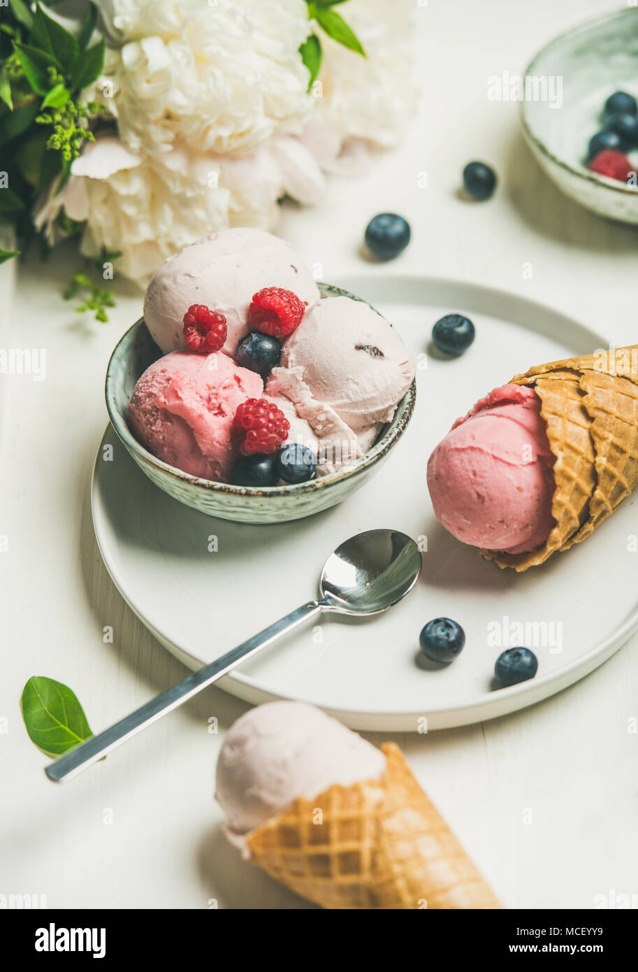 Pink strawberry and coconut ice cream scoops in bowl Stock Photo Alamy