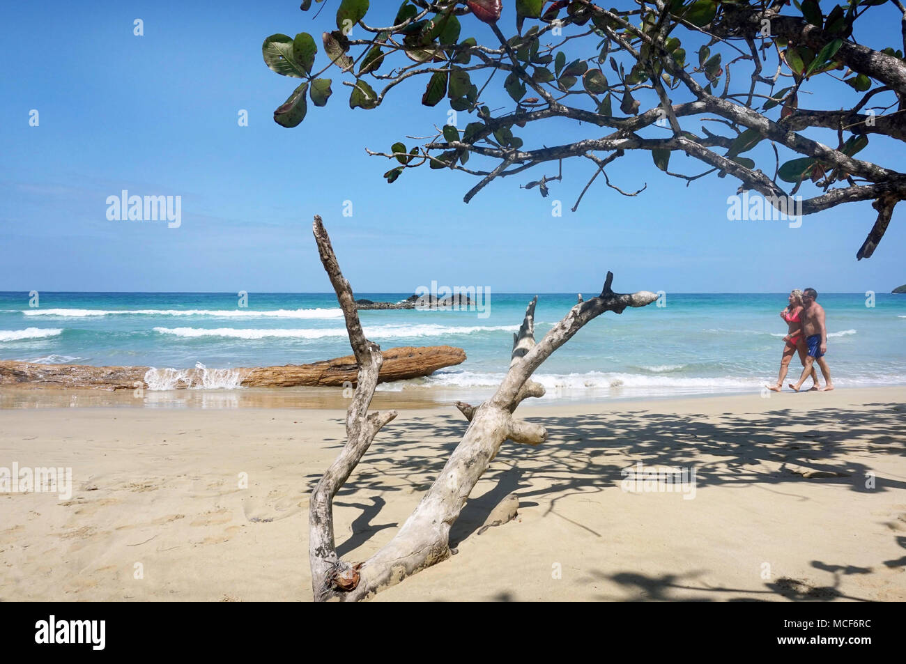Caribbean beach with couple at red frog beach.Isla Bastimentos Panama Stock Photo