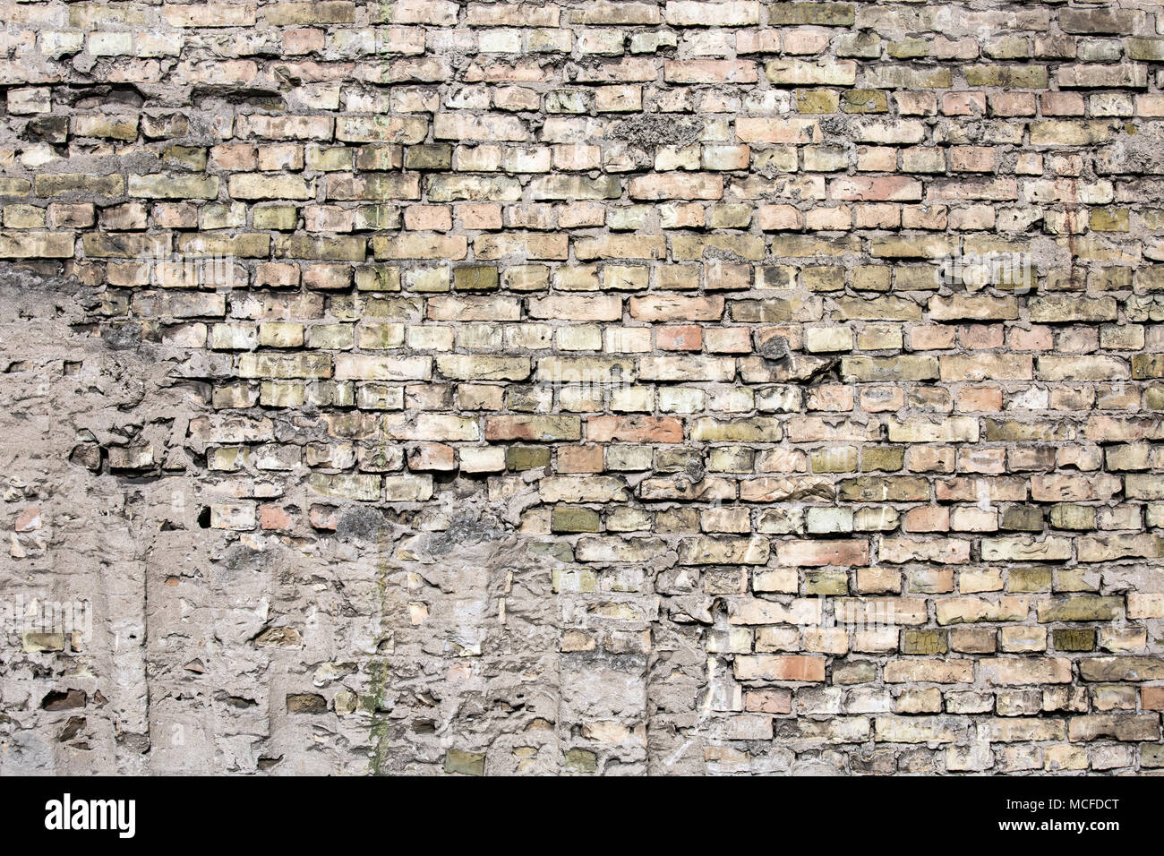 Cracked black brick wall Stock Photo